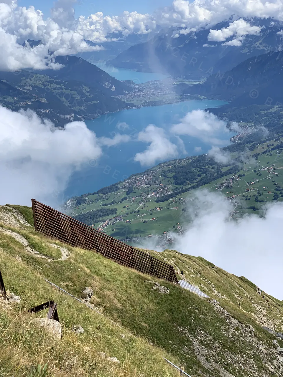 Niesenbahn — Lake Thun from the Niesen summit as the clouds break