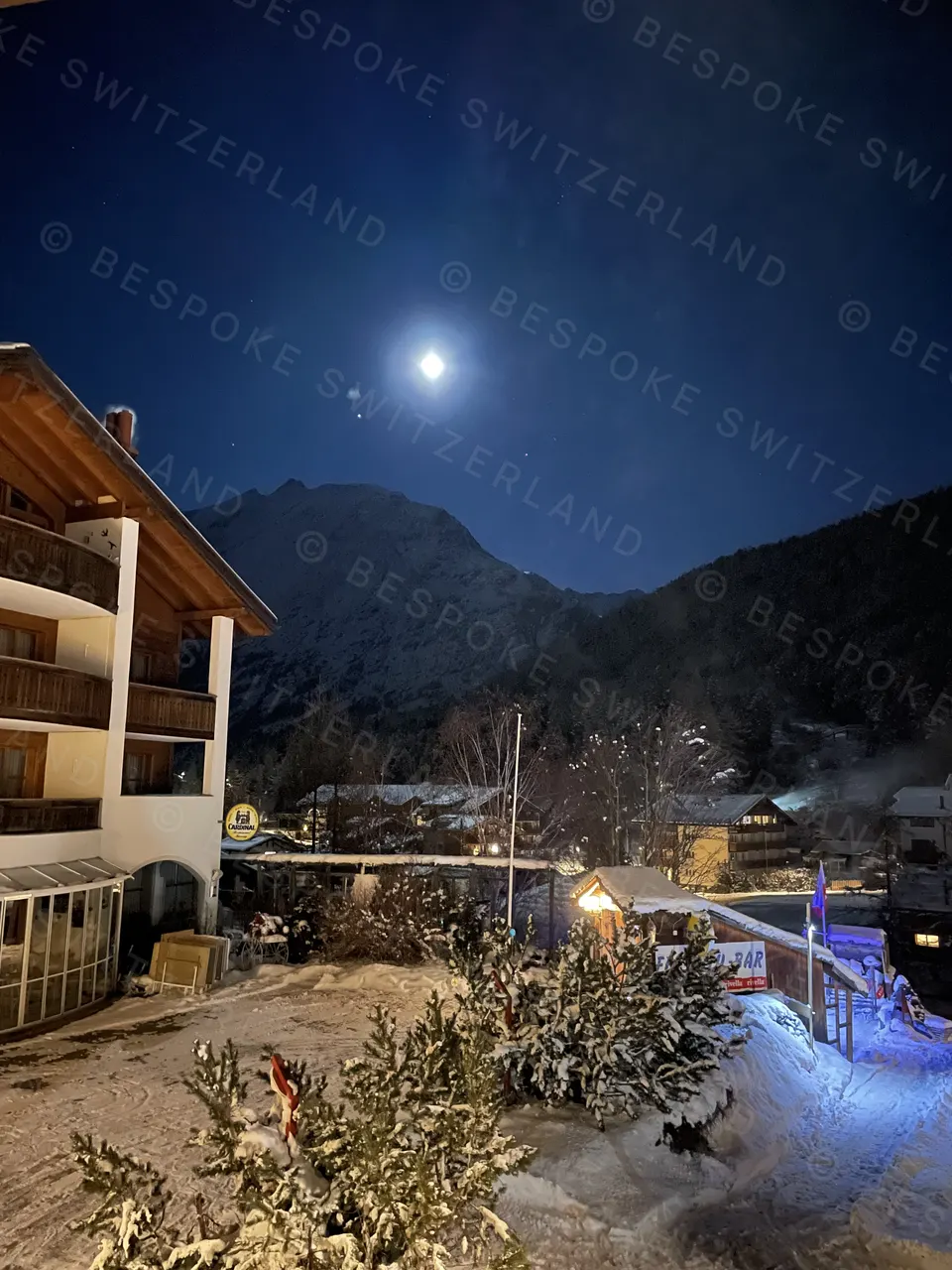 Saas-Fee village under a winter moon