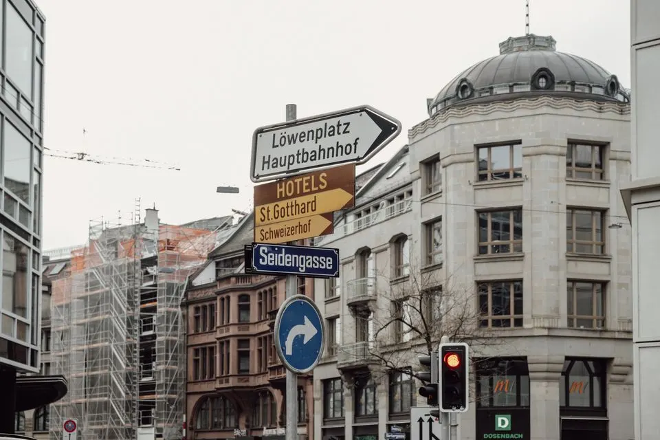 The Home Hotel Zürich — Explore Zurich's urban charm with detailed signage and architecture in this city scene.